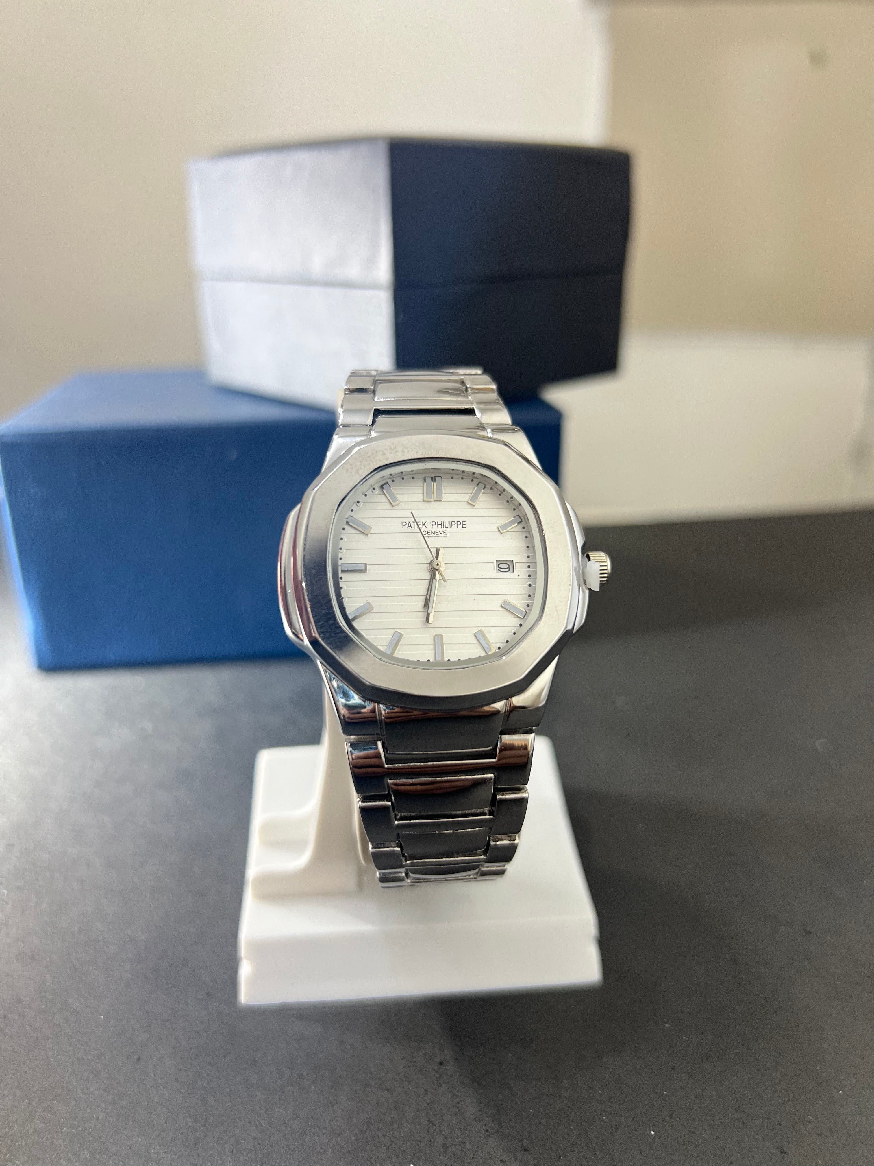 Patek Philippe White dial with date.